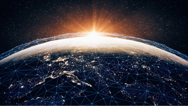 Sun rising over the globe with points on the globe showing connectivity